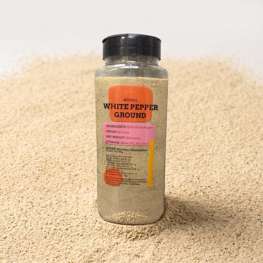 White Pepper Powder jar on bed of ground white pepper powder